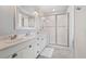 Elegant bathroom featuring a double sink vanity, walk-in shower and modern finishes at 5532 Summit Gln, Bradenton, FL 34203