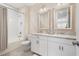 Stylish bathroom with double vanity, granite countertops, framed mirrors, and a tub with shower at 5532 Summit Gln, Bradenton, FL 34203