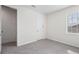 Well-lit bedroom featuring plush carpet, an exterior window, and two doors for easy access at 5532 Summit Gln, Bradenton, FL 34203