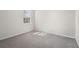 Bright, empty bedroom with plush carpet, large window letting in plenty of natural light at 5532 Summit Gln, Bradenton, FL 34203