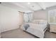 Charming bedroom with white wooden beams, a sliding barn door, and stylish modern decor at 5532 Summit Gln, Bradenton, FL 34203