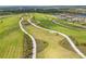 Extensive community park featuring walking paths, grassy areas, and workout equipment at 5532 Summit Gln, Bradenton, FL 34203