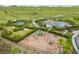 Playground near a basketball court and community pool with mature landscaping at 5532 Summit Gln, Bradenton, FL 34203