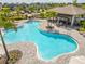 An inviting community pool features ample seating, shaded pergola, and lush landscaping for a relaxing atmosphere at 5532 Summit Gln, Bradenton, FL 34203