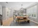 Bright dining room with views to the kitchen, featuring a wooden table set perfect for Gathering meals at 5532 Summit Gln, Bradenton, FL 34203
