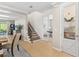 Welcoming foyer with staircase and french doors leading to the office, and views into the living area at 5532 Summit Gln, Bradenton, FL 34203