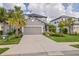 Charming two-story home featuring a two car garage, landscaped yard, and covered porch at 5532 Summit Gln, Bradenton, FL 34203