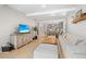 Comfortable living area with white sofa, modern decor, open to dining area, and a view into the kitchen at 5532 Summit Gln, Bradenton, FL 34203