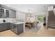 Open-concept kitchen and living area with stairs, seamlessly blending style and functionality at 5532 Summit Gln, Bradenton, FL 34203
