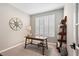 Bright office space with natural light from shuttered windows and neutral walls creating a serene working environment at 5532 Summit Gln, Bradenton, FL 34203