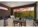Screened outdoor kitchen and dining area next to the pool, perfect for entertaining and enjoying the view at 5532 Summit Gln, Bradenton, FL 34203