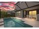 A screened pool with integrated steps leads to an outdoor patio, perfect for relaxation and entertainment at 5532 Summit Gln, Bradenton, FL 34203