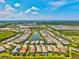Breathtaking aerial perspective of a neighborhood nestled among multiple lakes and green spaces, offering a peaceful residential setting at 5740 Eagle Creek Rd, Sarasota, FL 34238
