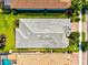 Aerial view of a well maintained roof surrounded by landscaping and nearby homes with pools, conveying a sense of upscale living at 5740 Eagle Creek Rd, Sarasota, FL 34238