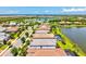 Picturesque aerial view of a lakeside community with homes featuring pools, lush landscaping, and serene water views at 5740 Eagle Creek Rd, Sarasota, FL 34238