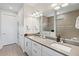 Bright bathroom features double vanity, modern fixtures, and tile flooring at 5740 Eagle Creek Rd, Sarasota, FL 34238
