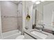 Bright bathroom featuring modern tiles, a shower, and stylish decor and sink at 5740 Eagle Creek Rd, Sarasota, FL 34238