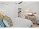 Bright bedroom featuring rustic style furniture, TV, and windows for great lighting at 5740 Eagle Creek Rd, Sarasota, FL 34238