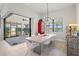 Bright dining room with modern decor and an expansive view of the water at 5740 Eagle Creek Rd, Sarasota, FL 34238