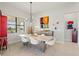 Dining room features a modern light fixture and a beautiful view of the water at 5740 Eagle Creek Rd, Sarasota, FL 34238