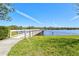 A long dock extends into the lake, providing a spot to enjoy the views and nature at 5740 Eagle Creek Rd, Sarasota, FL 34238