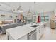 Spacious open concept kitchen features island seating with adjacent living and dining areas at 5740 Eagle Creek Rd, Sarasota, FL 34238