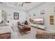 Living room featuring modern decor, television, and windows for natural light at 5740 Eagle Creek Rd, Sarasota, FL 34238