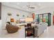 Cozy living room with tray ceilings, recessed lights, ample seating, and views of the outdoor space at 5740 Eagle Creek Rd, Sarasota, FL 34238