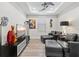 Features a well-lit sitting room with two leather couches, wall art, and a view at 5740 Eagle Creek Rd, Sarasota, FL 34238