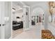 Open-concept living space with a glass door, tile flooring, and a seamless flow between rooms at 5740 Eagle Creek Rd, Sarasota, FL 34238