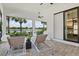 Spacious patio with lounge chairs, outdoor furniture, water view, and lush landscaping at 5740 Eagle Creek Rd, Sarasota, FL 34238