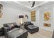Sitting area with leather couches and ottoman, with a view into the next room at 5740 Eagle Creek Rd, Sarasota, FL 34238