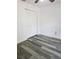 Bedroom with wood-look floors and a double door closet at 5849 Wagon Wheel Dr, North Port, FL 34291