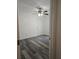 This bedroom is a blank canvas with gray wood-look floors and a ceiling fan at 5849 Wagon Wheel Dr, North Port, FL 34291