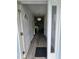 Inviting front entry displaying pristine hardwood floors and a stylish chandelier at 5849 Wagon Wheel Dr, North Port, FL 34291