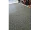 View of newly finished garage floor with speckled epoxy coating for a clean and modern look, enhancing the space's functionality at 5849 Wagon Wheel Dr, North Port, FL 34291