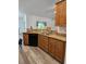 Kitchen featuring granite countertops, wood cabinets, and stainless steel appliances at 5849 Wagon Wheel Dr, North Port, FL 34291