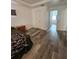 Spacious primary bedroom with hardwood floors leads to ensuite and walk-in closet at 5849 Wagon Wheel Dr, North Port, FL 34291