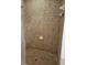 Shower stall featuring decorative, neutral-toned tiles and a tiled floor at 5849 Wagon Wheel Dr, North Port, FL 34291