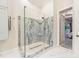 Bathroom featuring an open shower with decorative stone and glass surround at 5988 Viola Rd, Venice, FL 34293