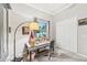 Bright bedroom featuring a workstation, natural light, and a calming atmosphere perfect for creative pursuits or relaxation at 5988 Viola Rd, Venice, FL 34293