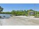 Public boat ramp leading to the waterway; sandy beach and information kiosk at 5988 Viola Rd, Venice, FL 34293