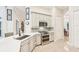 Kitchen featuring stainless appliances, tile floors, and modern white cabinetry at 5988 Viola Rd, Venice, FL 34293