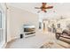 Bright living room with ceiling fan and a view to the kitchen and dining area at 5988 Viola Rd, Venice, FL 34293