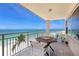 Balcony with seating area overlooking the beach at 601 Longboat Club Rd # 504S, Longboat Key, FL 34228