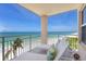 Balcony with lounge chairs and stunning views of the beach at 601 Longboat Club Rd # 504S, Longboat Key, FL 34228