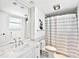 Clean, well-lit bathroom with marble countertops, a shower, and modern fixtures at 601 Longboat Club Rd # 504S, Longboat Key, FL 34228