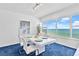 Dining room with a white table set for a meal, ocean views at 601 Longboat Club Rd # 504S, Longboat Key, FL 34228
