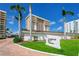 Well-manicured lawn and sign to Longboat Key Towers condo buildings at 601 Longboat Club Rd # 504S, Longboat Key, FL 34228