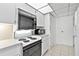 Vintage-style kitchen with white appliances and tile flooring at 601 Longboat Club Rd # 504S, Longboat Key, FL 34228